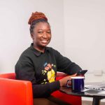 NiYA Stock Photo_Young girl sitting in her office (1)